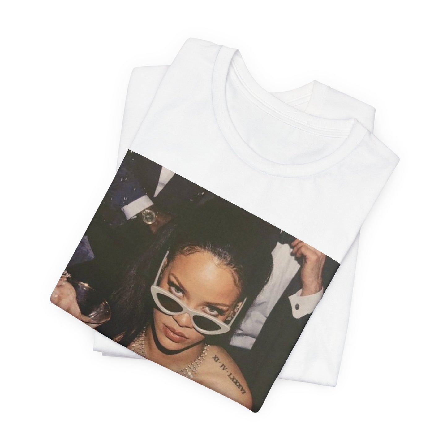 A black graphic t-shirt featuring a graphic of Rihanna as a 'Bad Gal Riri' fashion icon.