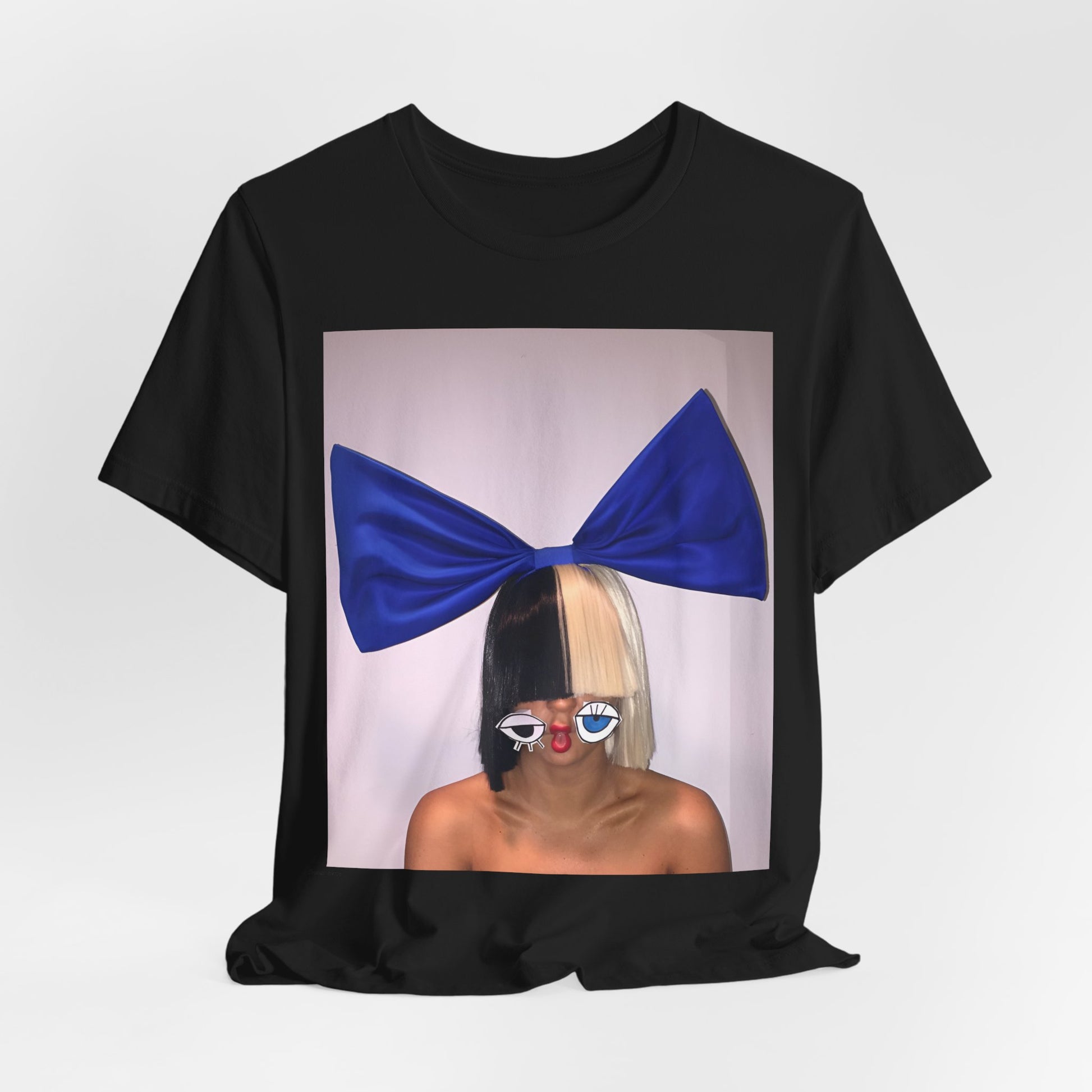 A black graphic t-shirt featuring a graphic of Sia with her iconic wig, in an aesthetic style.