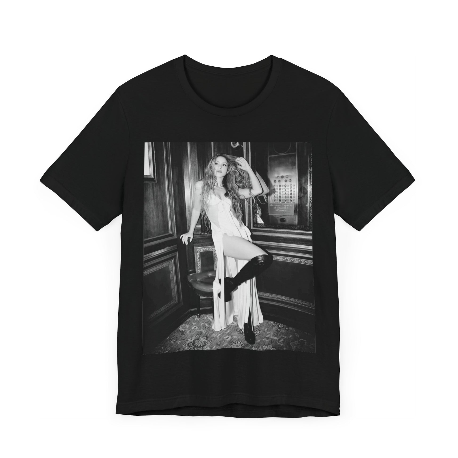 A black graphic t-shirt featuring a retro black and white monochrome graphic or photo of Shakira.