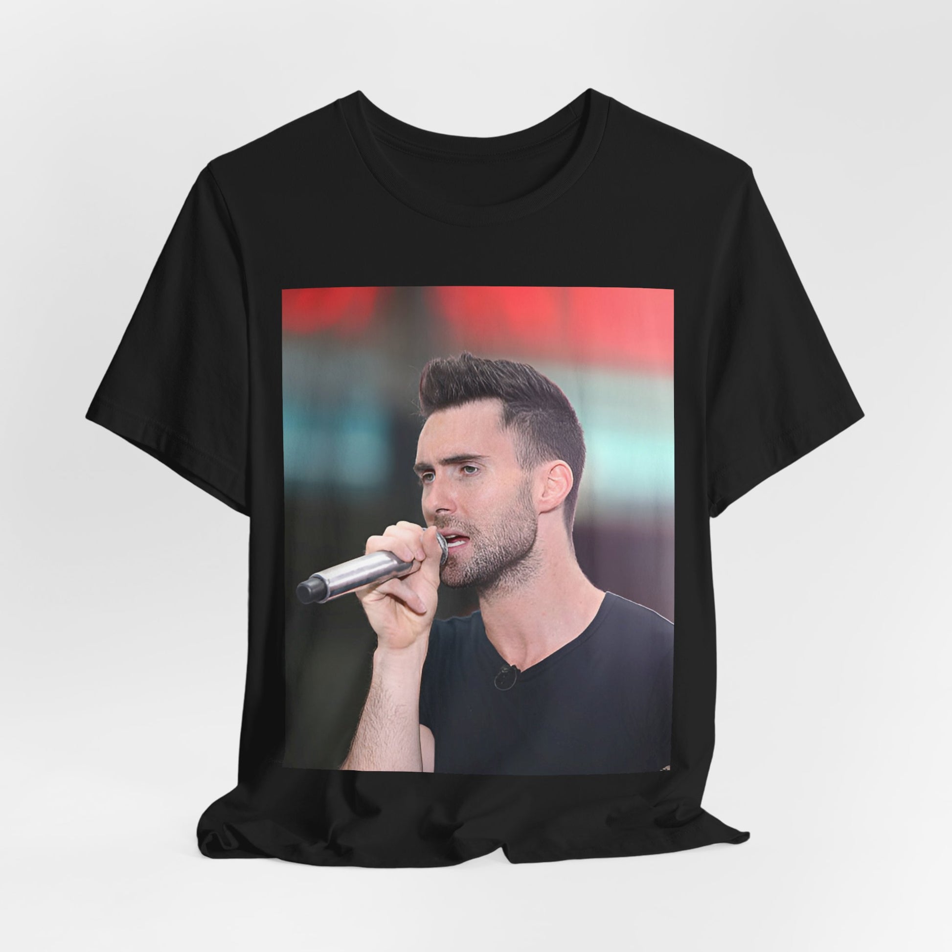 A stylized graphic inspired by the Maroon 5 song "Moves Like Jagger," with funky, retro design elements, on a t-shirt.