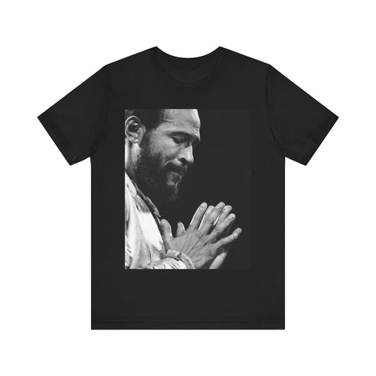 A black graphic t-shirt featuring a 70s graphic of Marvin Gaye emphasizing his soulful voice.