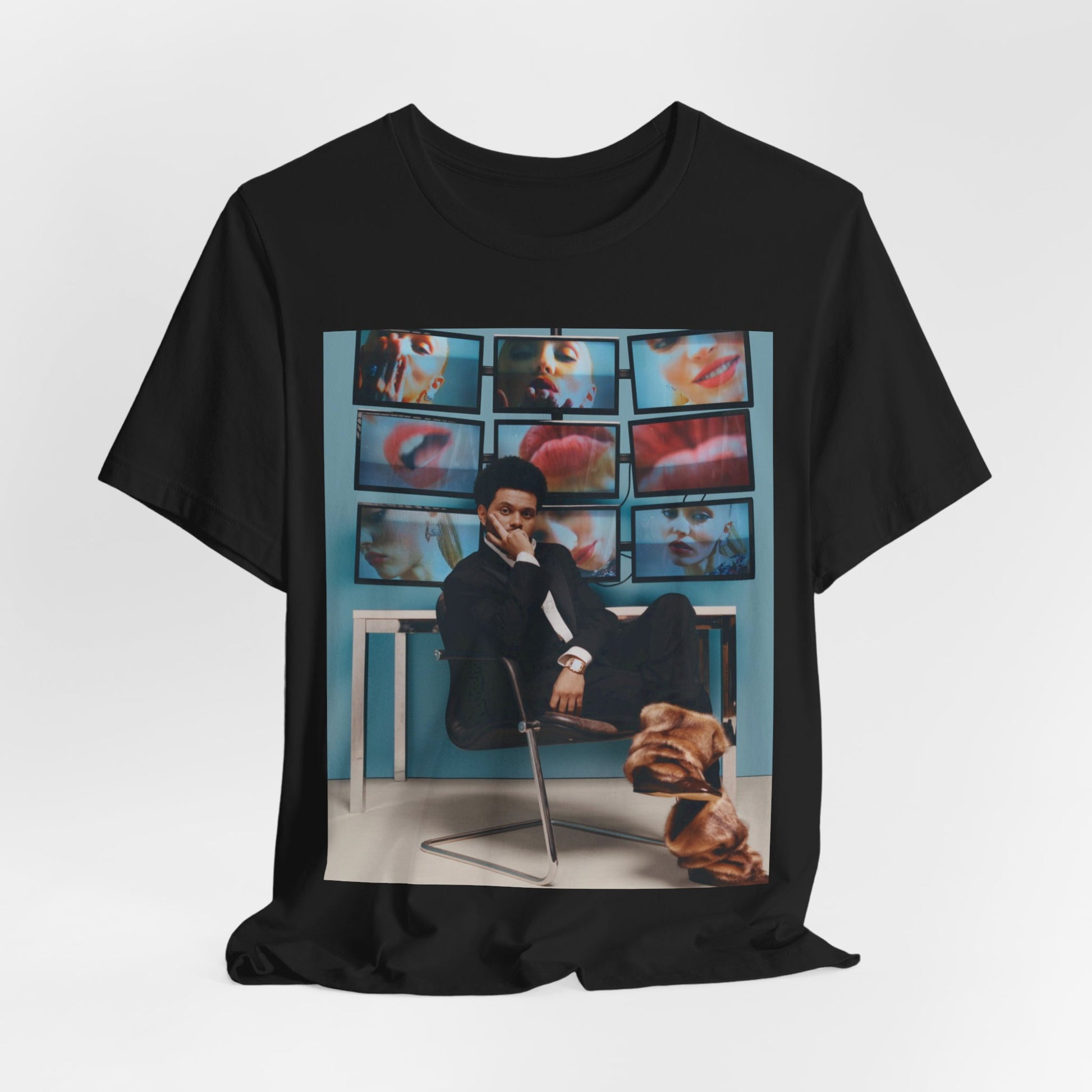 A black graphic t-shirt featuring an aesthetic graphic of The Weeknd.
