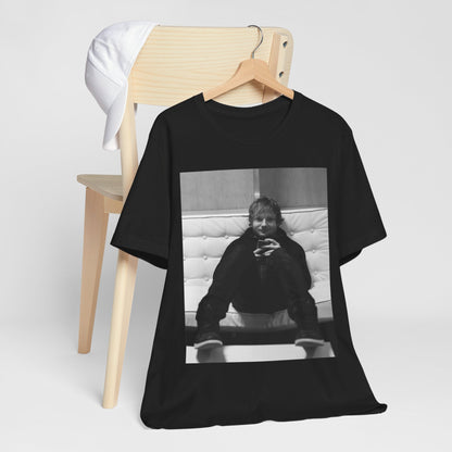 A black graphic t-shirt featuring a bold black and white graphic of Ed Sheeran.