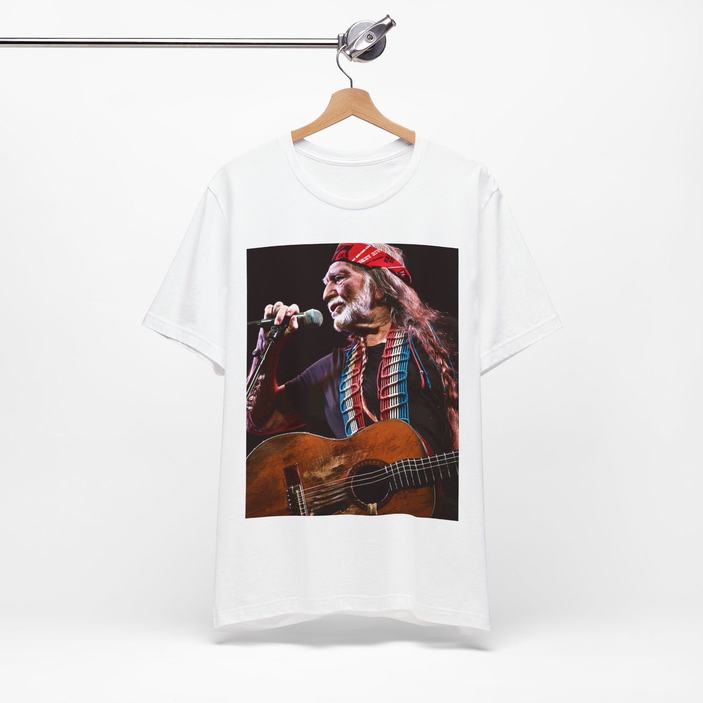 A black graphic t-shirt featuring a graphic of Willie Nelson with his iconic long hair and bandana.