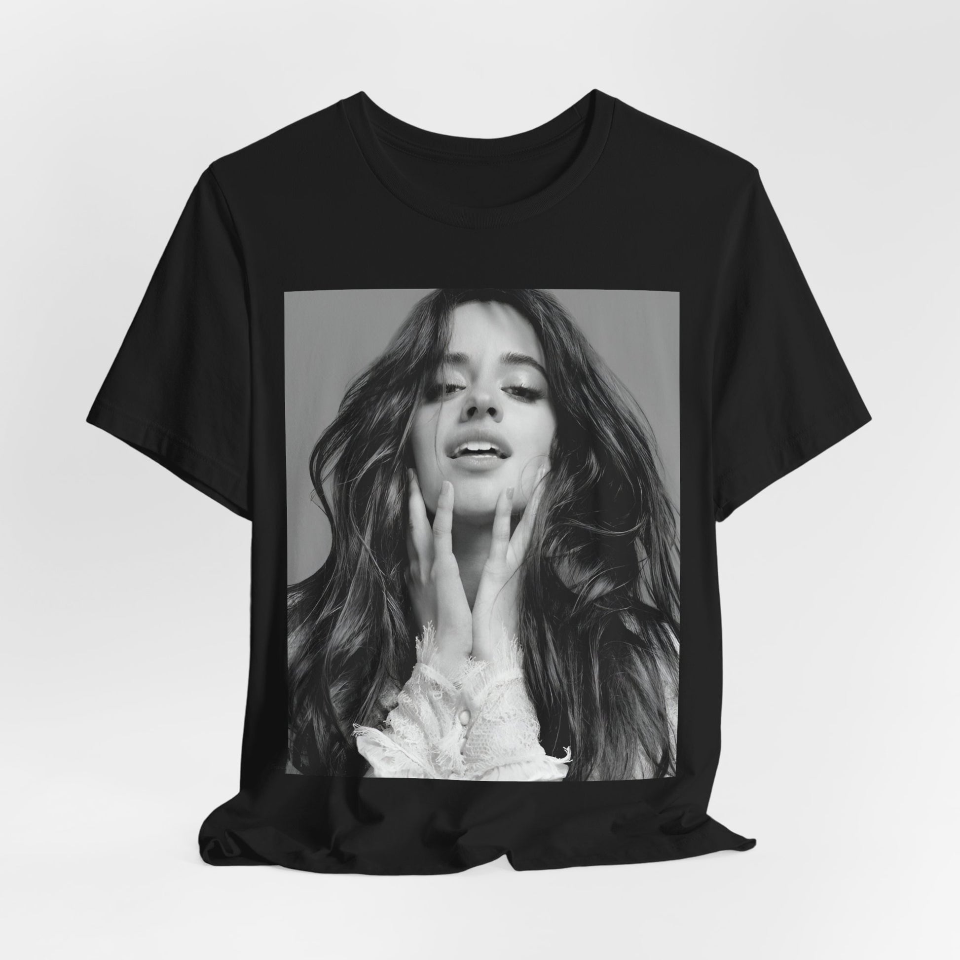 A black graphic t-shirt featuring a black and white portrait photo of Camila Cabello.