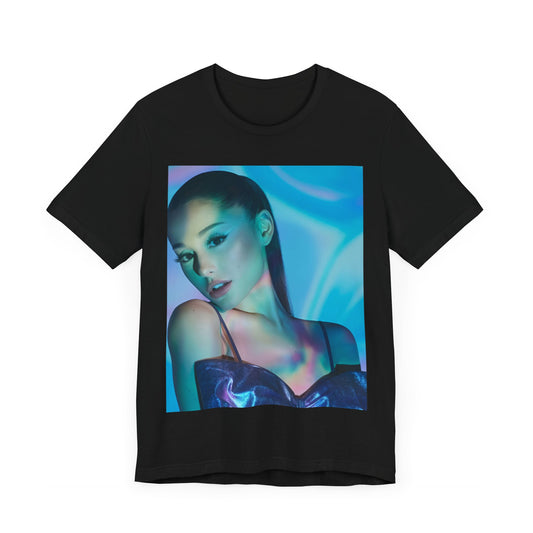 A black graphic t-shirt featuring a neon pop art style graphic of Ariana Grande, with bright colors and bold lines.