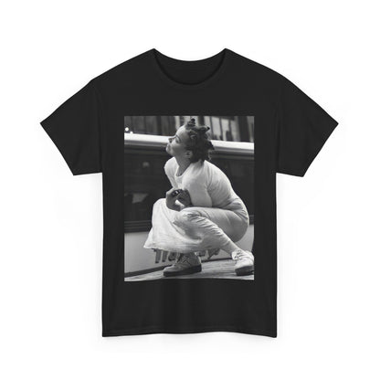 A black graphic t-shirt featuring a graphic of Bjork as an experimental pop icon.