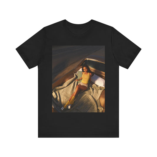 A black graphic t-shirt featuring a graphic of Tyla as an African fashion icon.