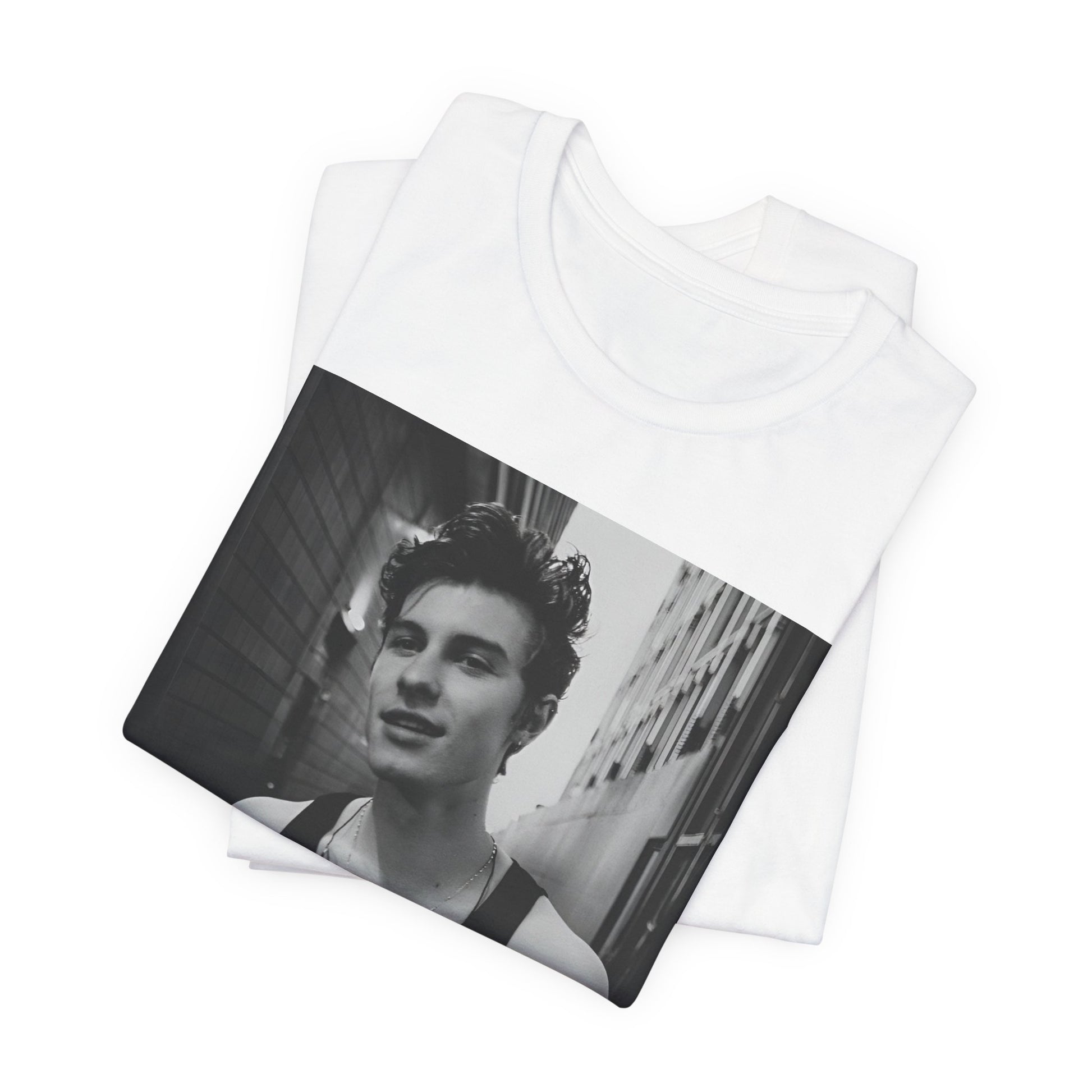 A black graphic t-shirt featuring a vintage black and white portrait graphic or photo of Shawn Mendes.