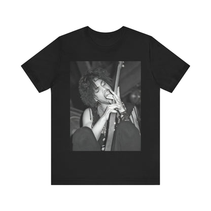 A black graphic t-shirt featuring a graphic or photo of Prince performing wildly on stage.