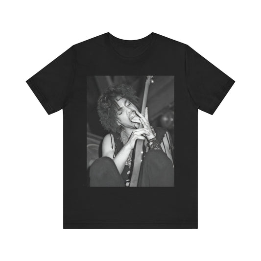 A black graphic t-shirt featuring a graphic or photo of Prince performing wildly on stage.