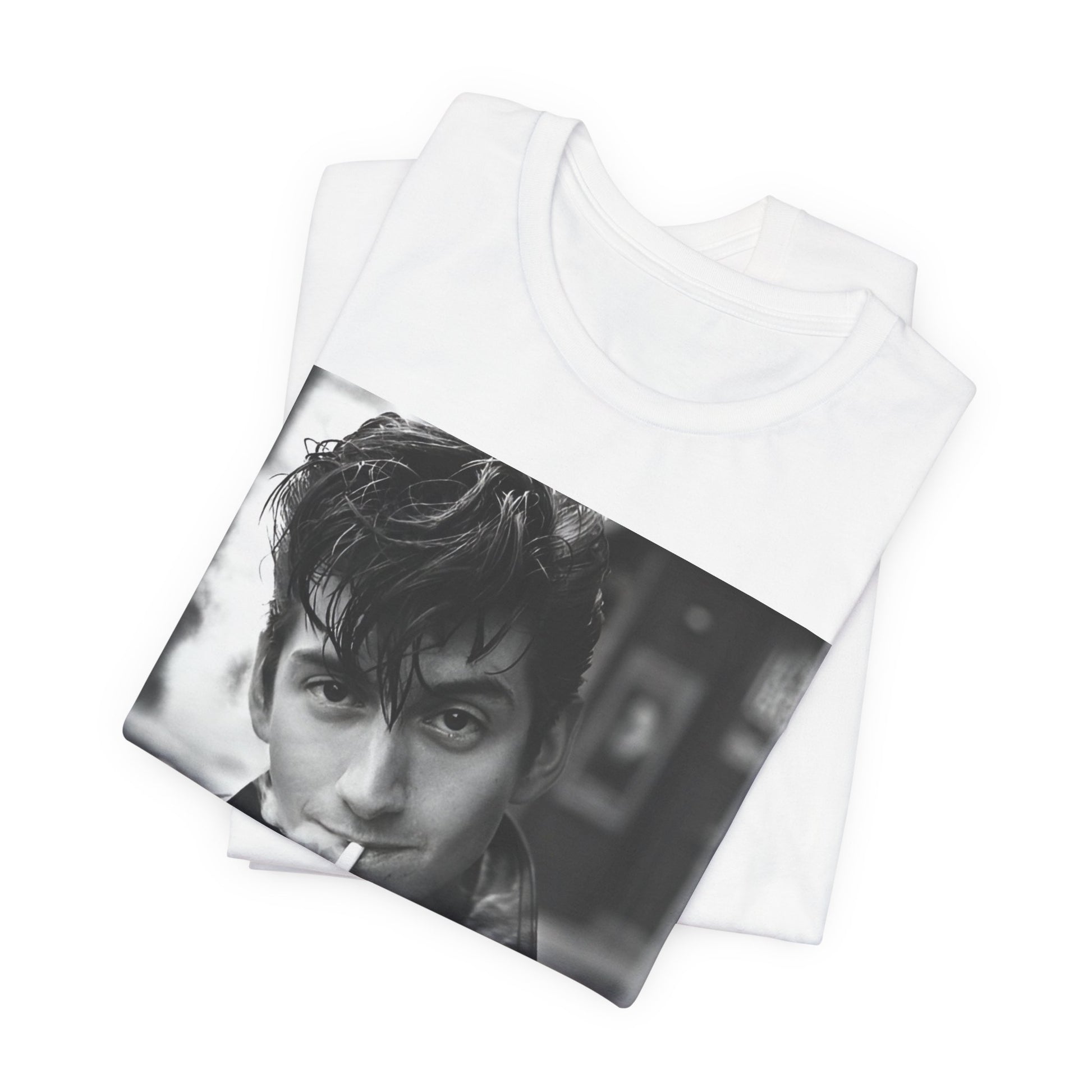 A black graphic t-shirt featuring a graphic of Alex Turner from Arctic Monkeys, in a rock star pose or setting.