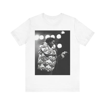 A black graphic t-shirt featuring a graphic or photo of Barry White performing live on stage in the 1970s.