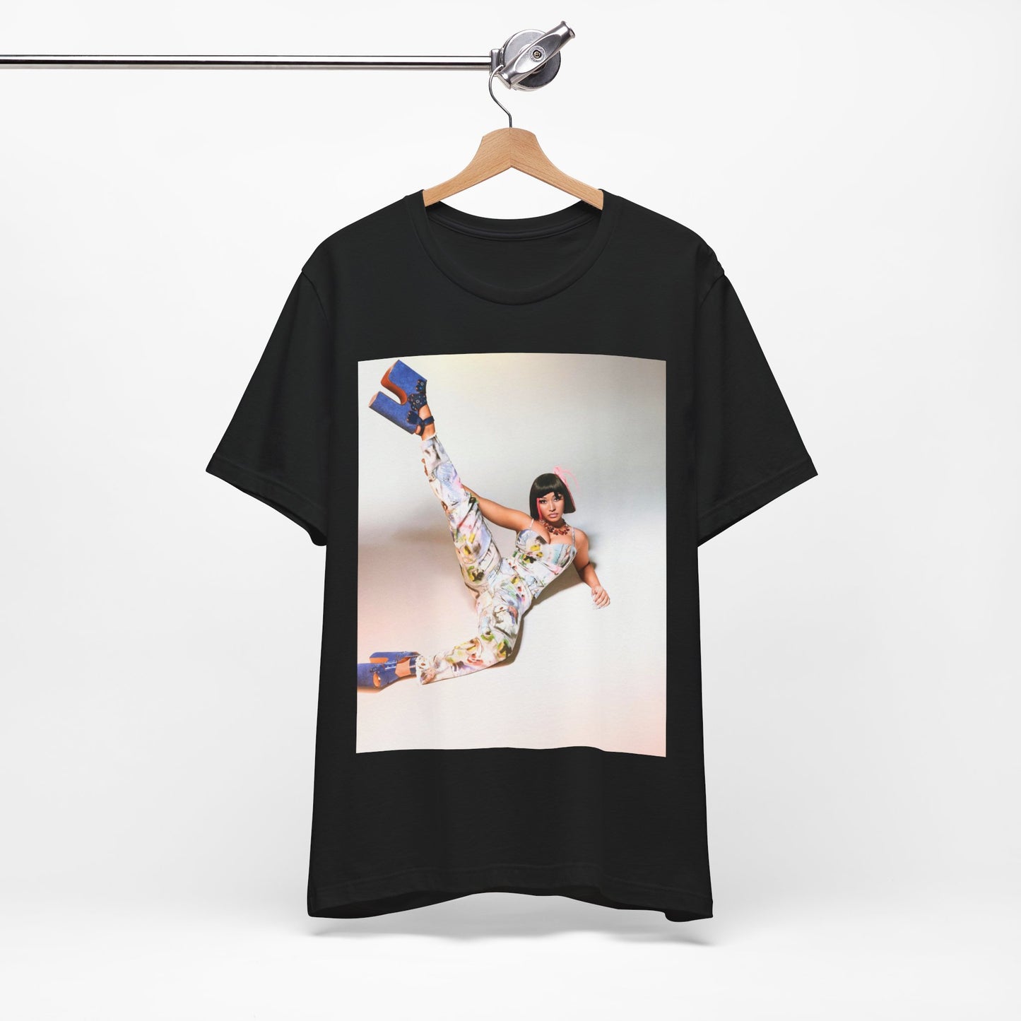 A black graphic t-shirt featuring a graphic of Nicki Minaj as a global fashion rap queen.