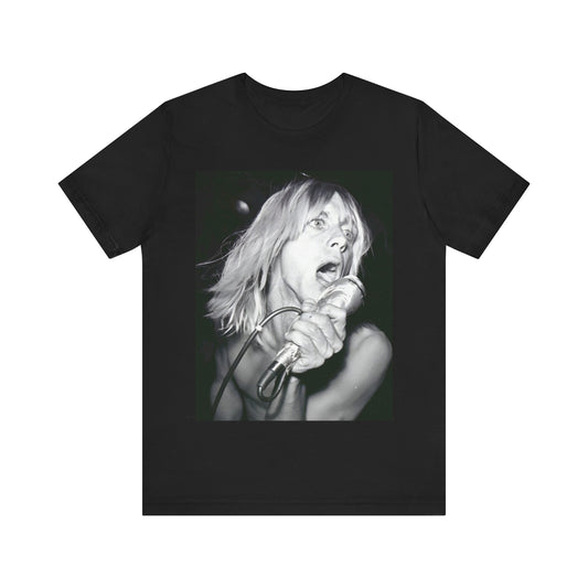 A black graphic t-shirt featuring a graphic of Iggy Pop as the Godfather of Punk, performing live.