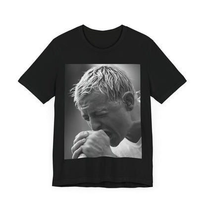A black graphic t-shirt featuring a graphic or photo of Chester Bennington from Linkin Park performing live on stage.