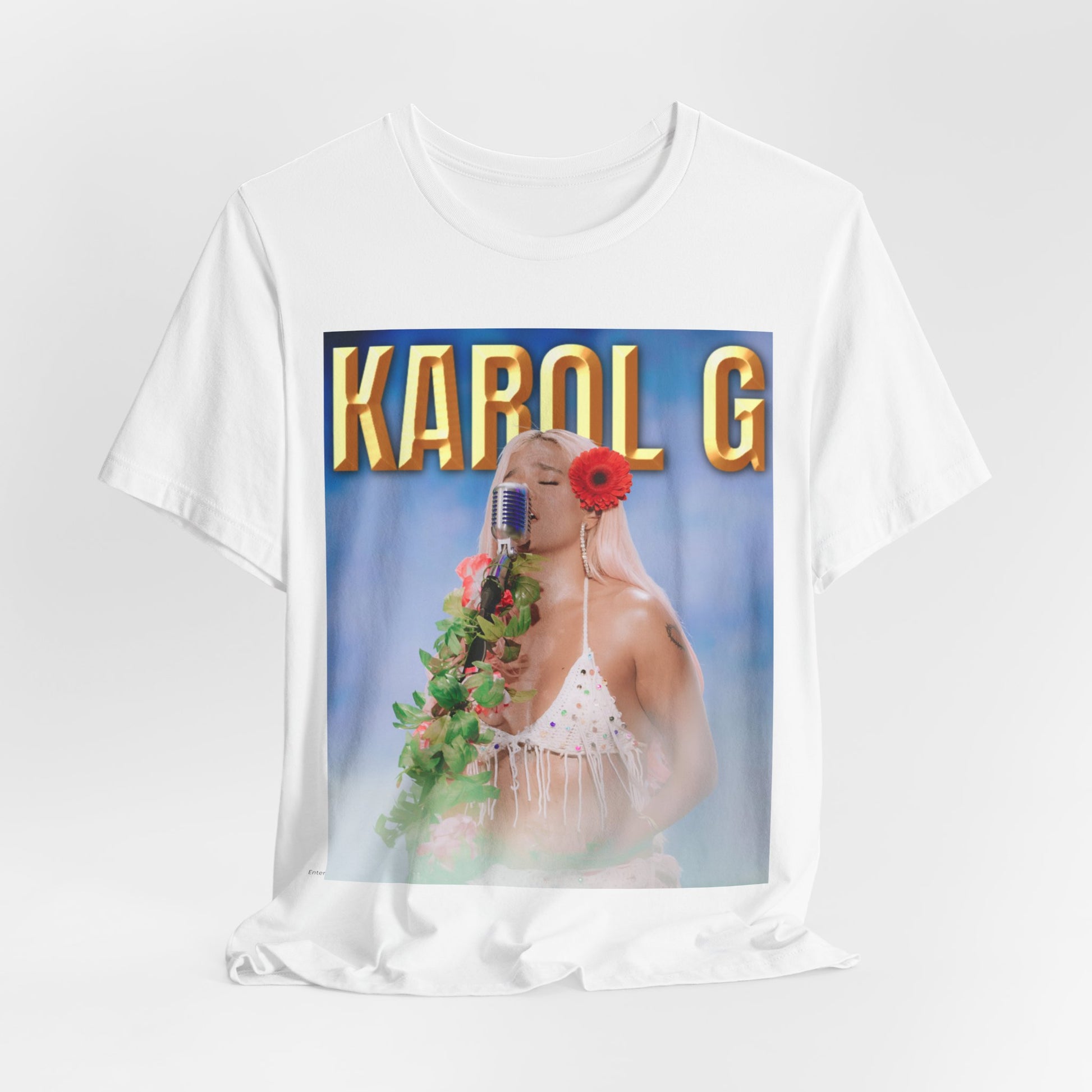 A black graphic t-shirt featuring a graphic of Karol G as a classic Latin pop queen.