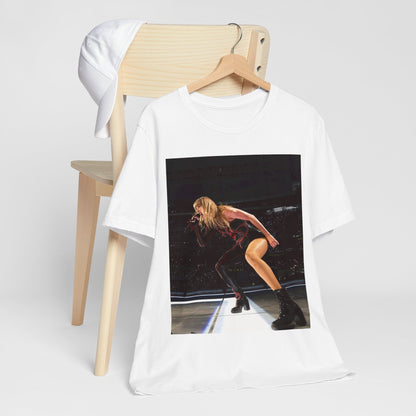 A black graphic t-shirt featuring a fierce graphic of Taylor Swift on stage.