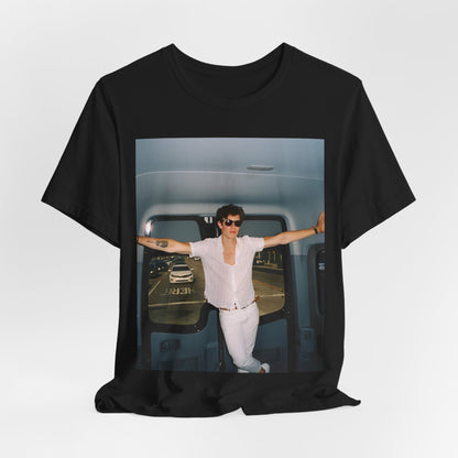 A black graphic t-shirt featuring a graphic of Shawn Mendes with a classic confident look.