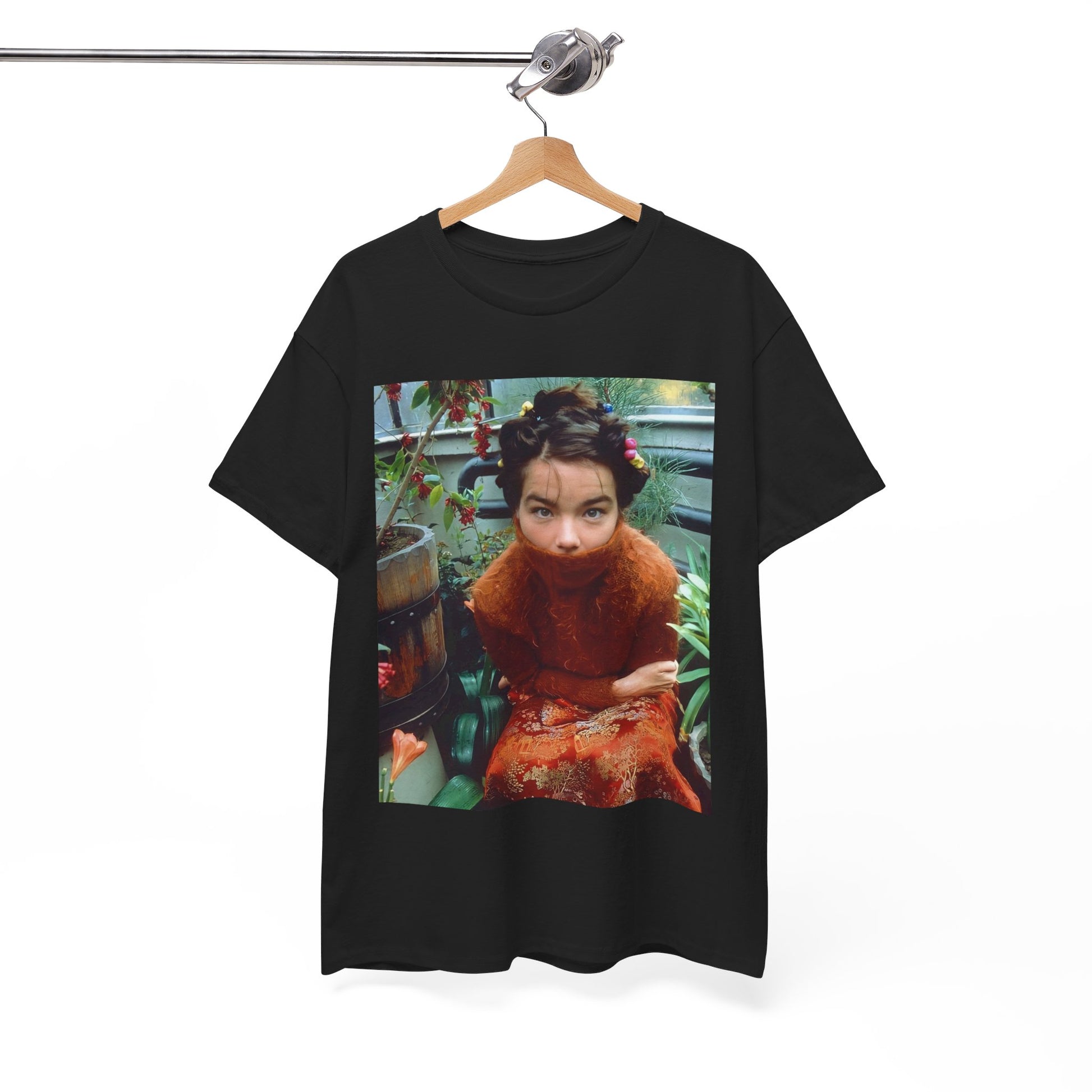 A black graphic t-shirt featuring a dynamic and 'fierce' graphic of Bjork, emphasizing her strong and confident presence.