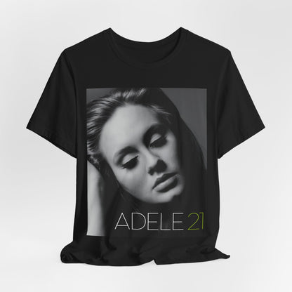 A black graphic t-shirt featuring the album cover art for Adele's '21' album, showing a close-up portrait of her with a contemplative expression.