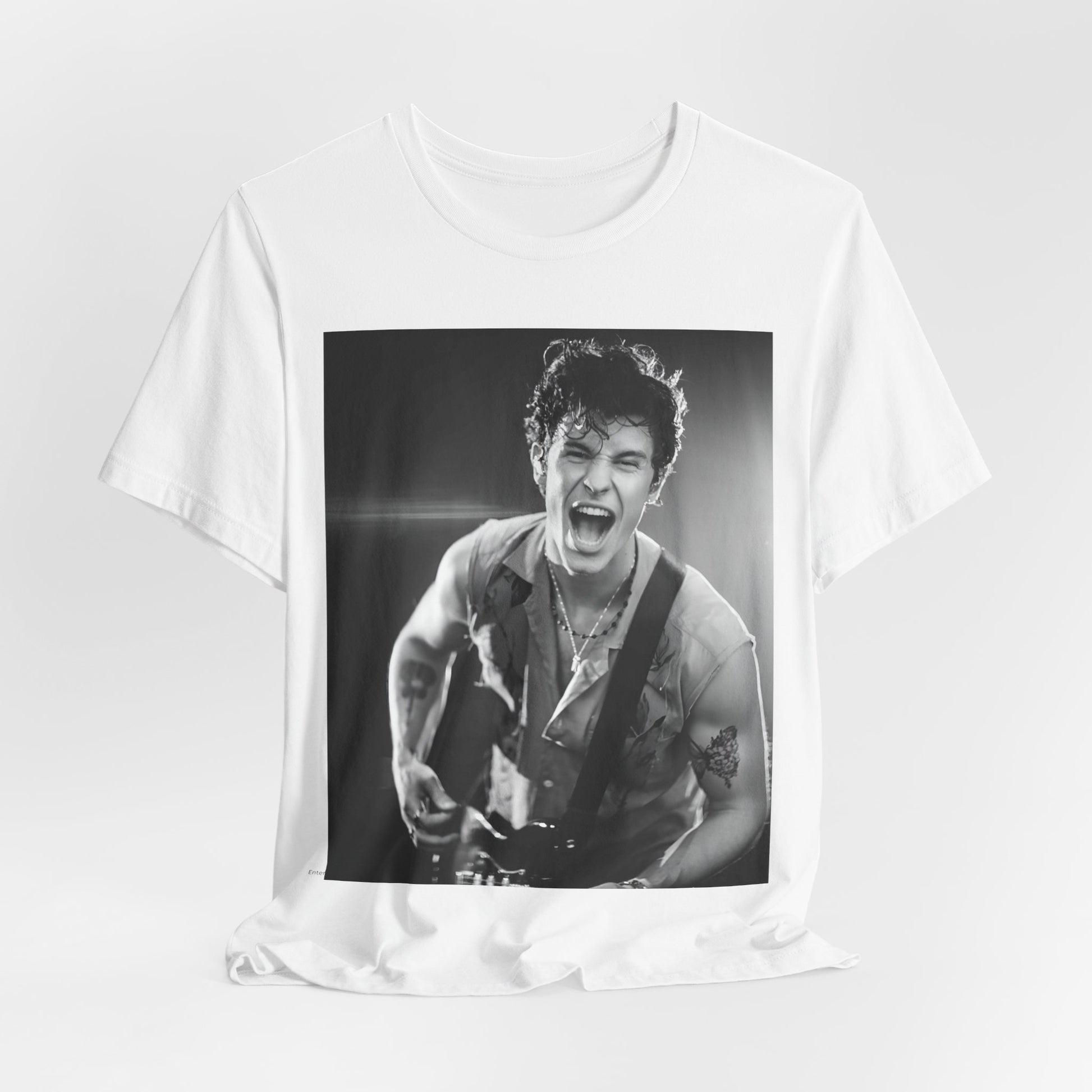 A black graphic t-shirt featuring a black and white photo of Shawn Mendes, emphasizing his charm.
