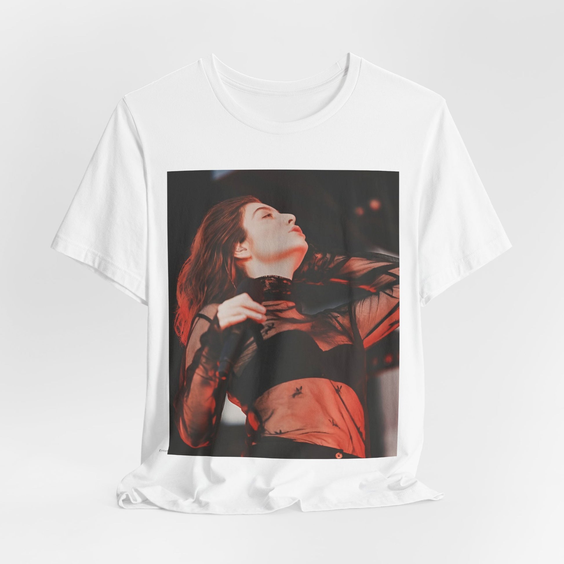 A black graphic t-shirt featuring a graphic of Lorde emphasizing raw emotion.