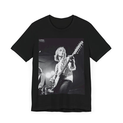 A black graphic t-shirt featuring a graphic of Tom Petty as a Rock & Roll Hall of Fame icon.