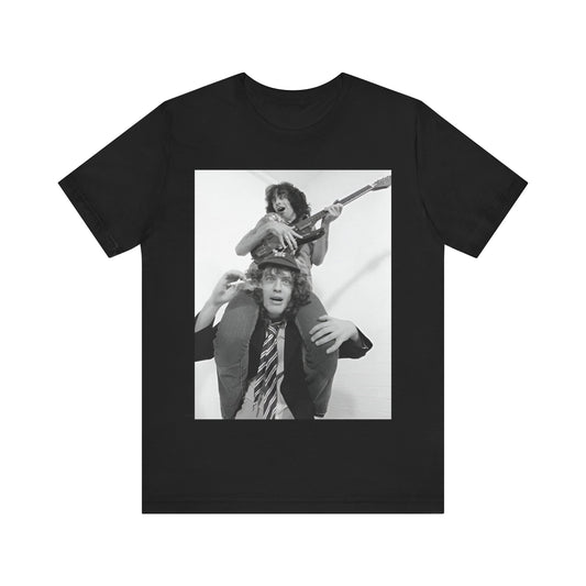 A black graphic t-shirt featuring a split image of AC/DC's Bon Scott and Angus Young, representing the band's iconic duo.