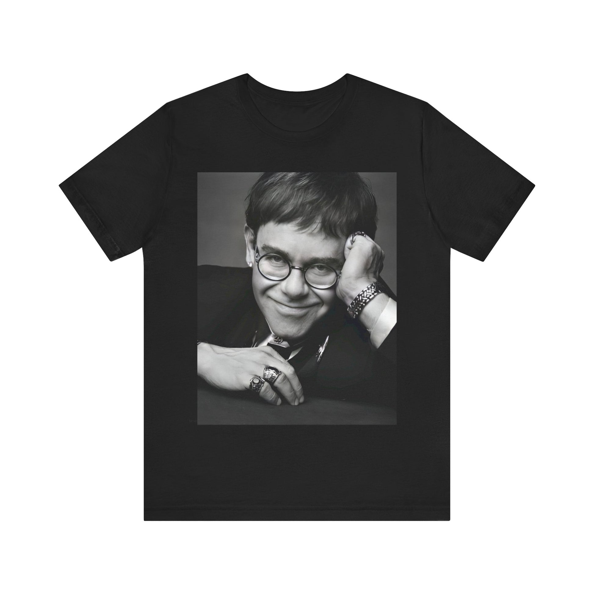 A black graphic t-shirt featuring a retro black and white photo portrait of Elton John.
