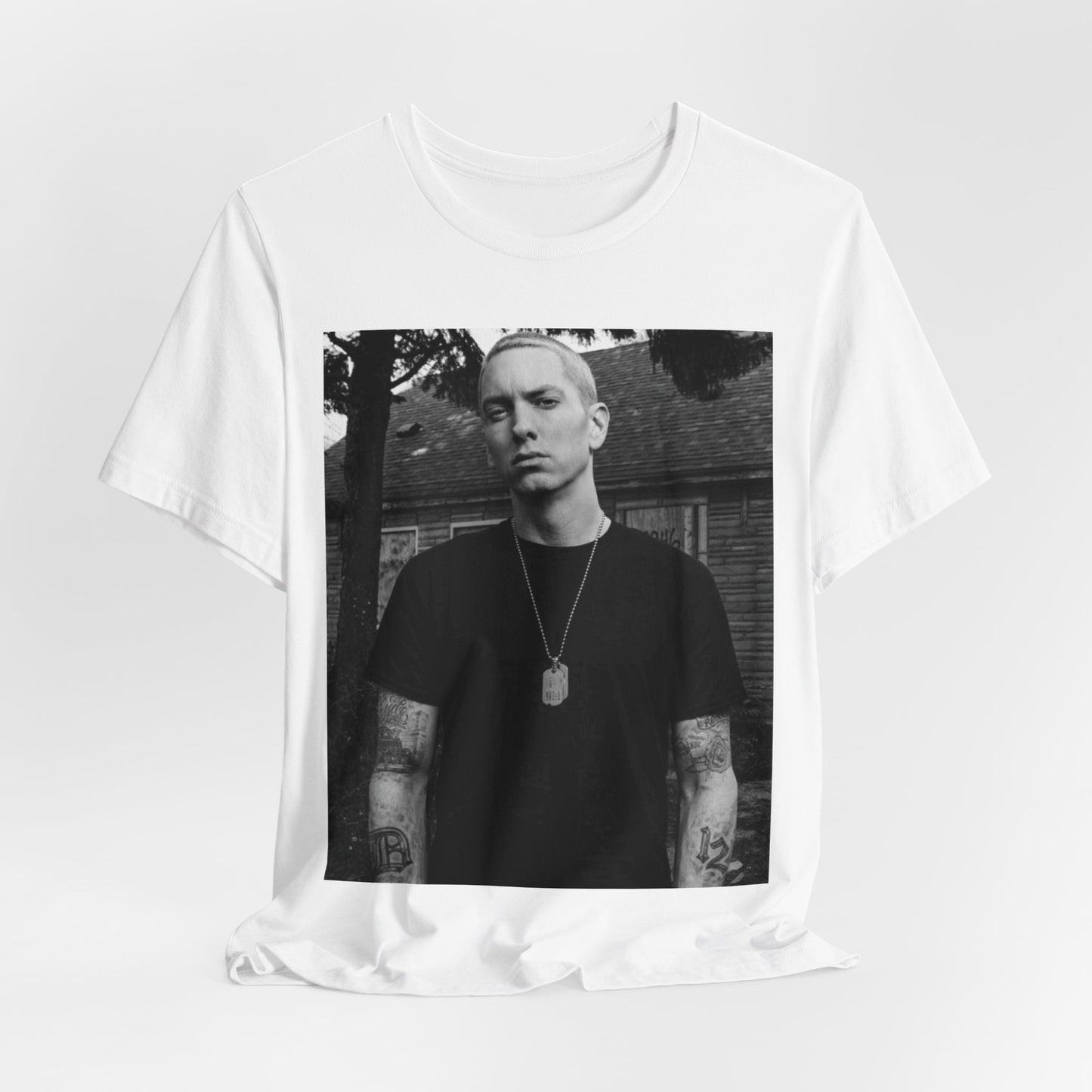 A black graphic t-shirt featuring a black and white graphic of Eminem as Slim Shady.