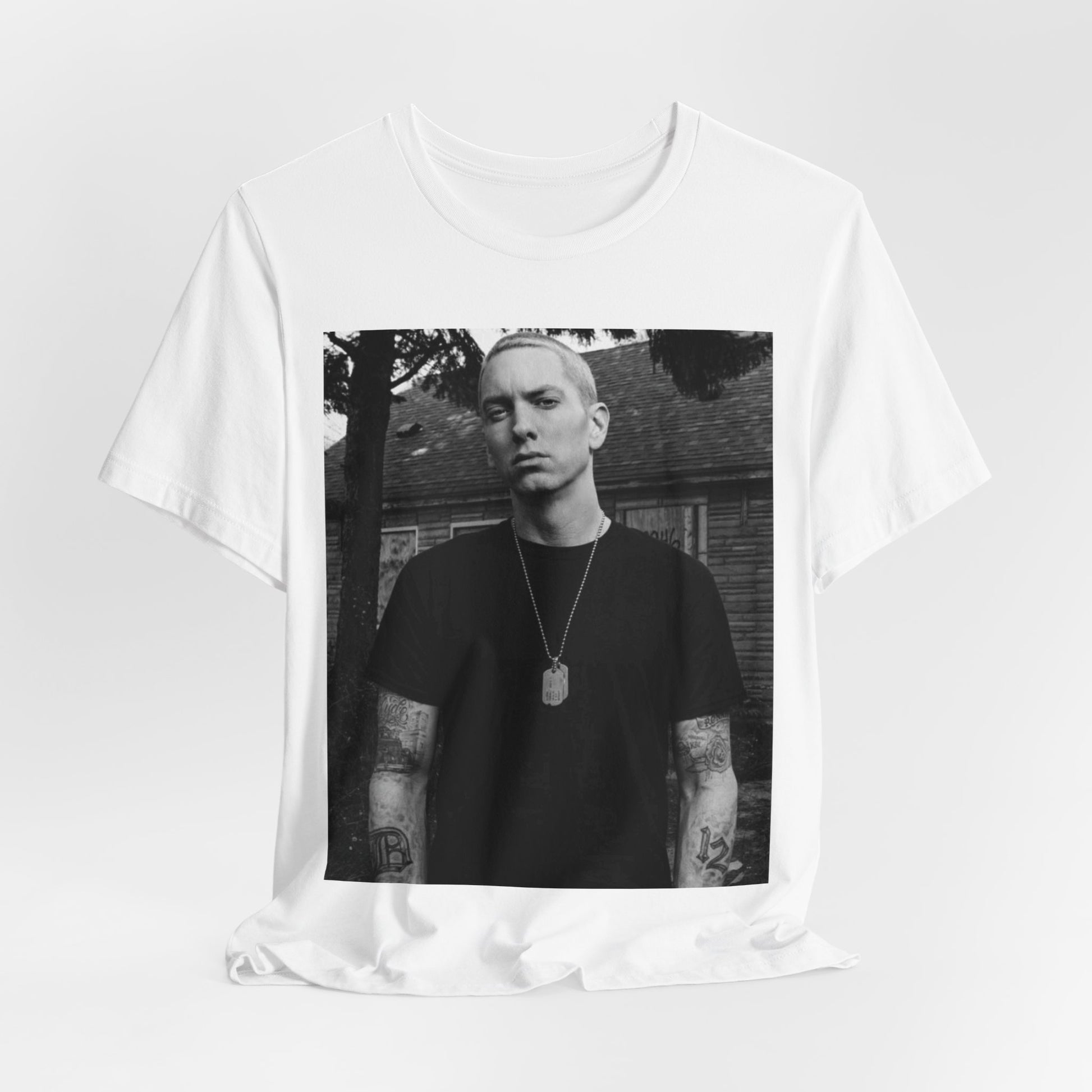 A black graphic t-shirt featuring a black and white graphic of Eminem as Slim Shady.