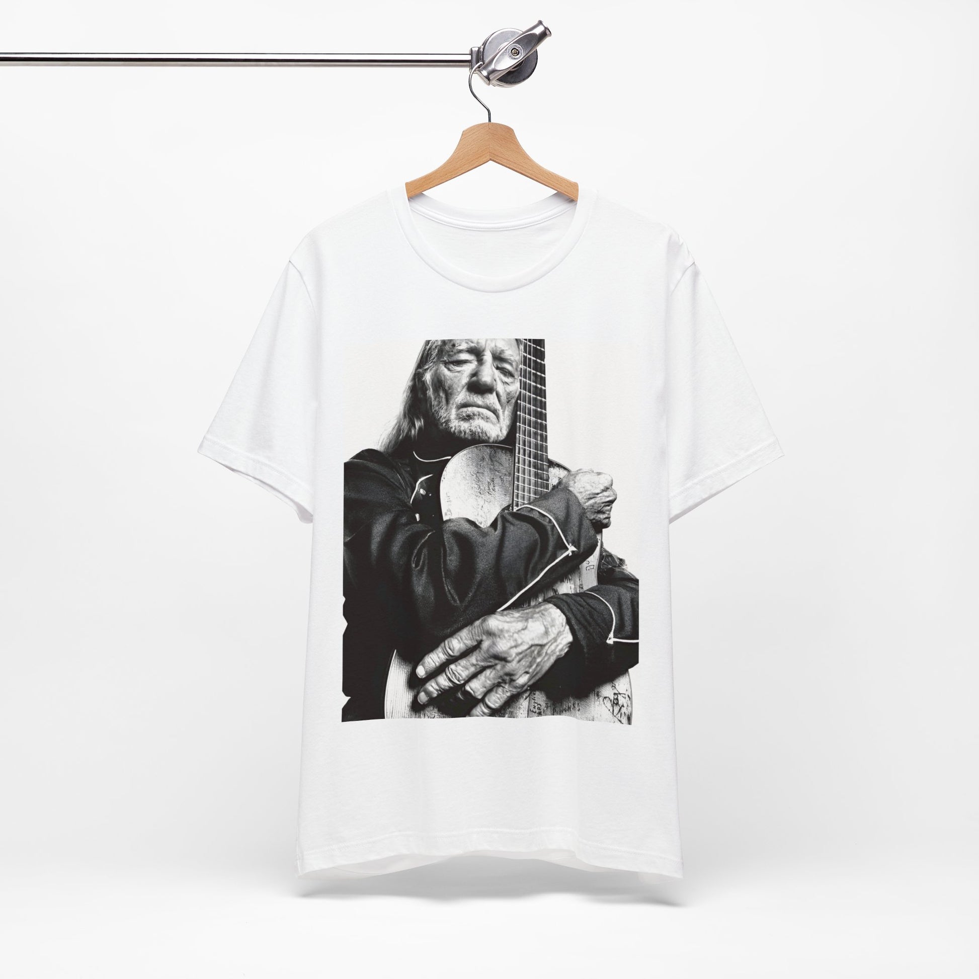 A black graphic t-shirt featuring a vintage country legend graphic of Willie Nelson.