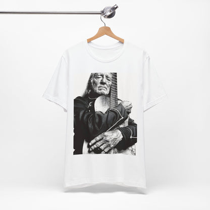 A black graphic t-shirt featuring a vintage country legend graphic of Willie Nelson.