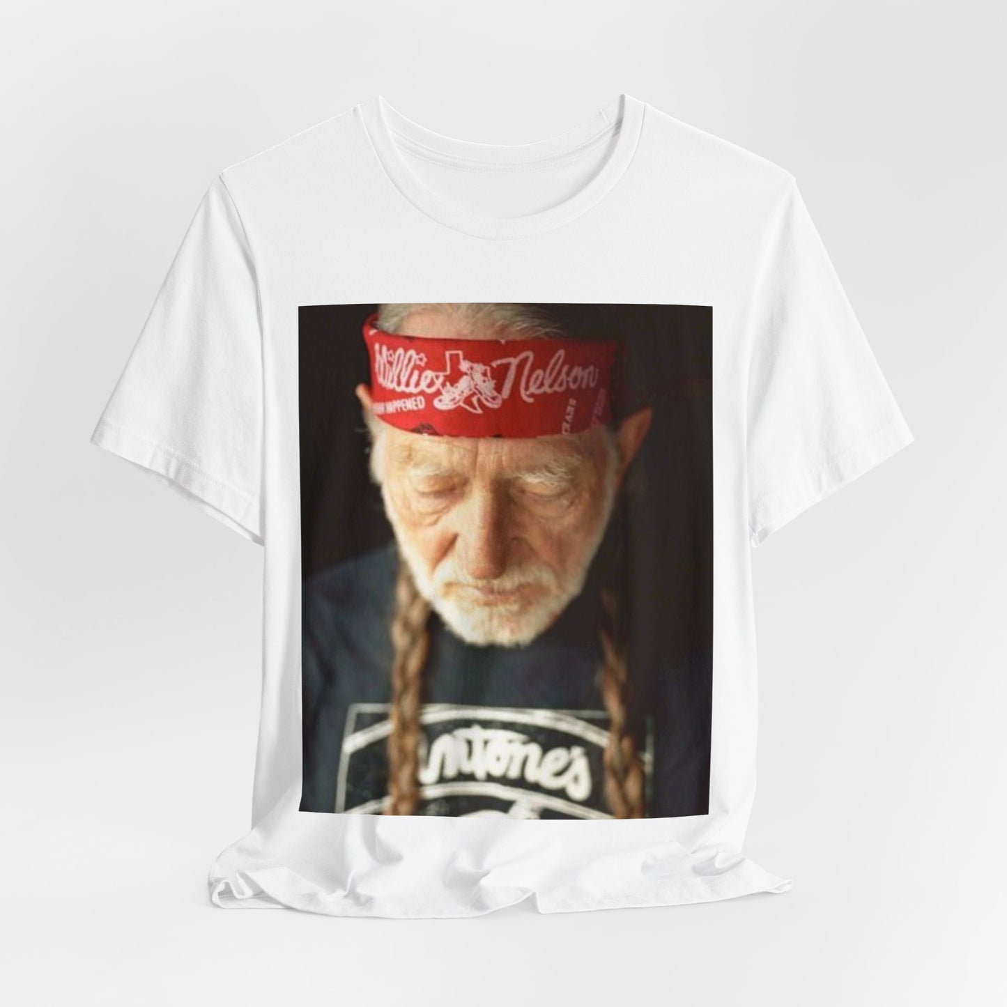 A black graphic t-shirt featuring a Texas music aesthetic graphic of Willie Nelson.