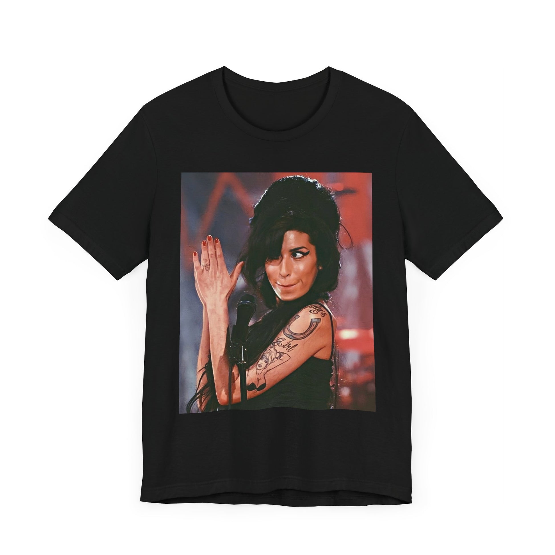 A black graphic t-shirt featuring a photo of Amy Winehouse performing live on stage in 2008, with her signature beehive and expressive singing.