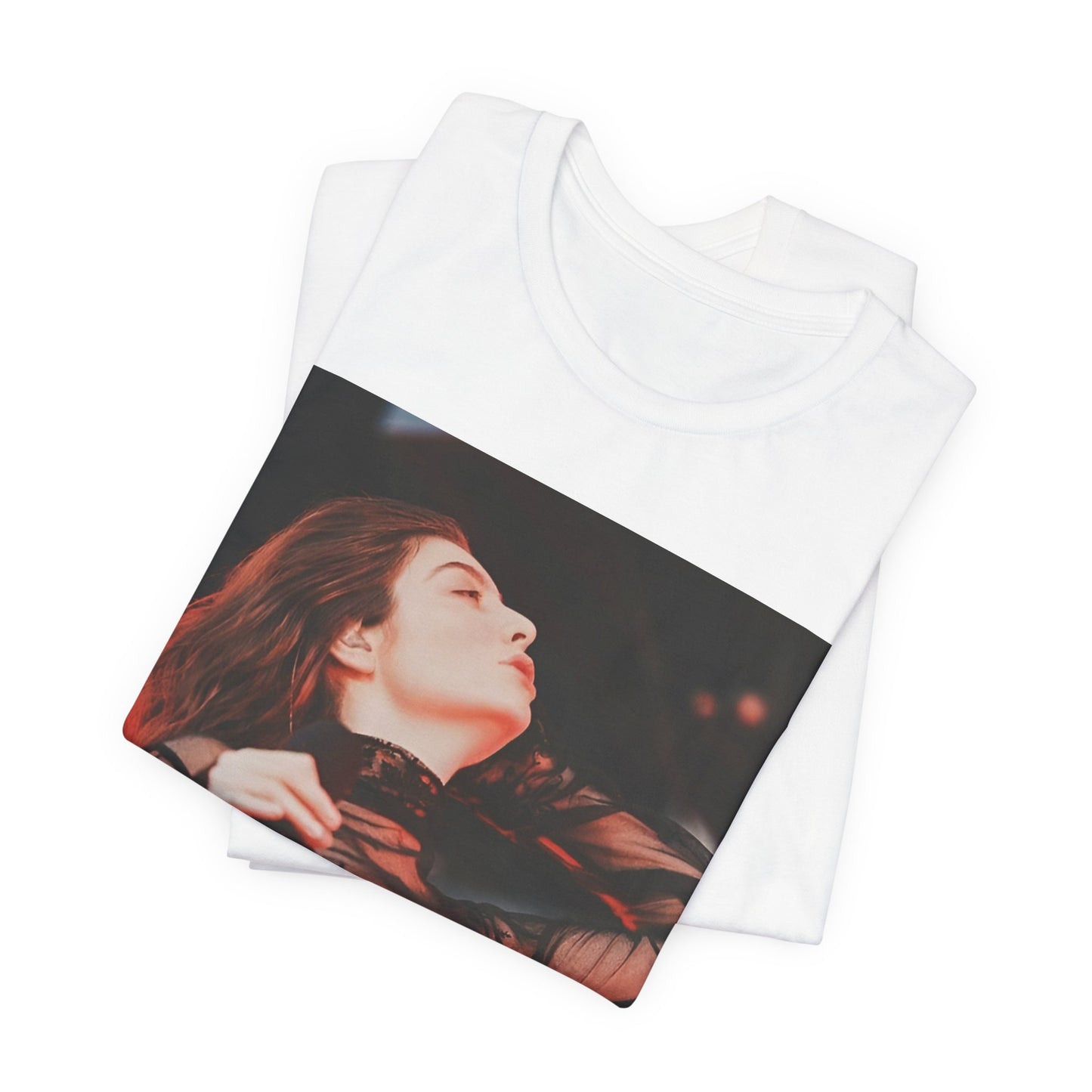 A black graphic t-shirt featuring a graphic of Lorde emphasizing raw emotion.