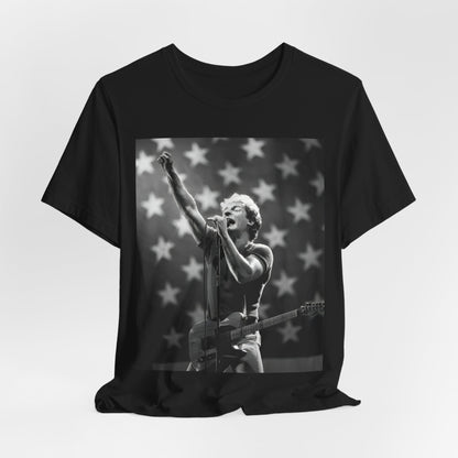 A black graphic t-shirt featuring a 70s era Americana-style graphic of Bruce Springsteen.