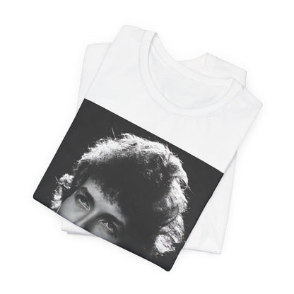 A black graphic t-shirt featuring a graphic of Bob Dylan from the 60s playing his harmonica.