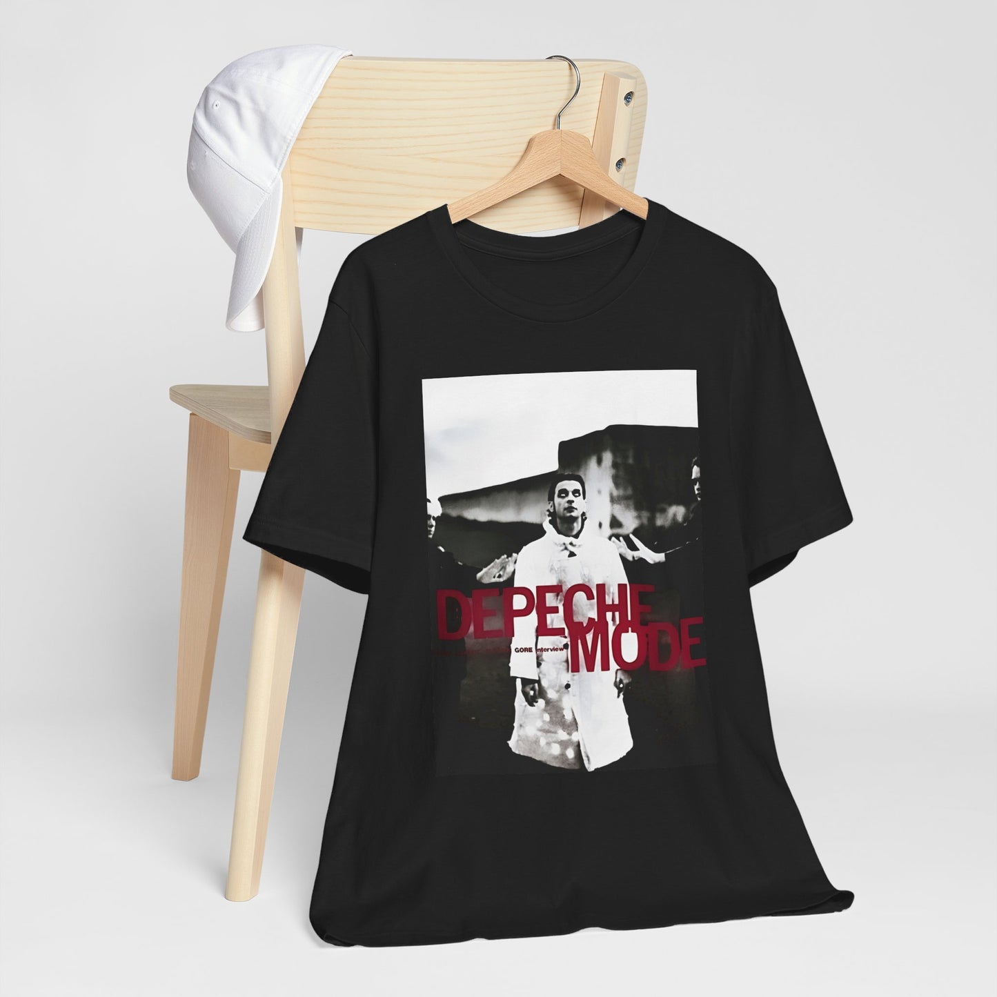 A black graphic t-shirt featuring a graphic related to Depeche Mode's 'Policy of Truth' song or era.