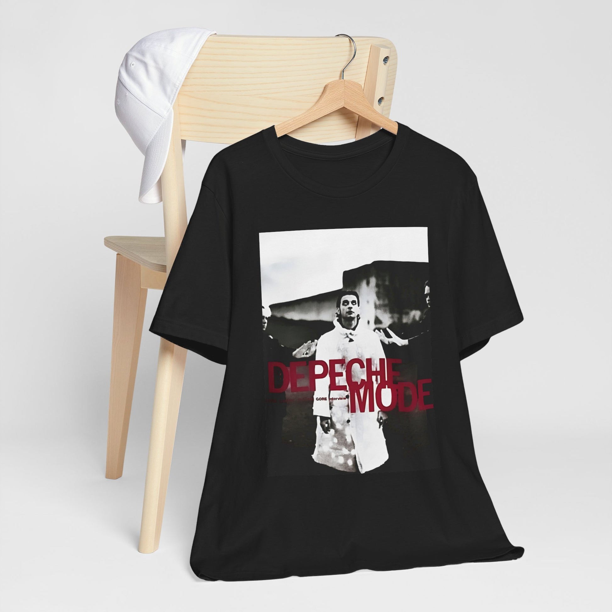 A black graphic t-shirt featuring a graphic related to Depeche Mode's 'Policy of Truth' song or era.