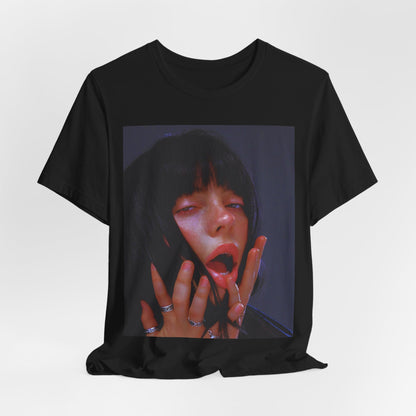 An intense, artistic photo of Billie Eilish with a bloody nose, conveying a sense of raw power, printed on a graphic t-shirt.
