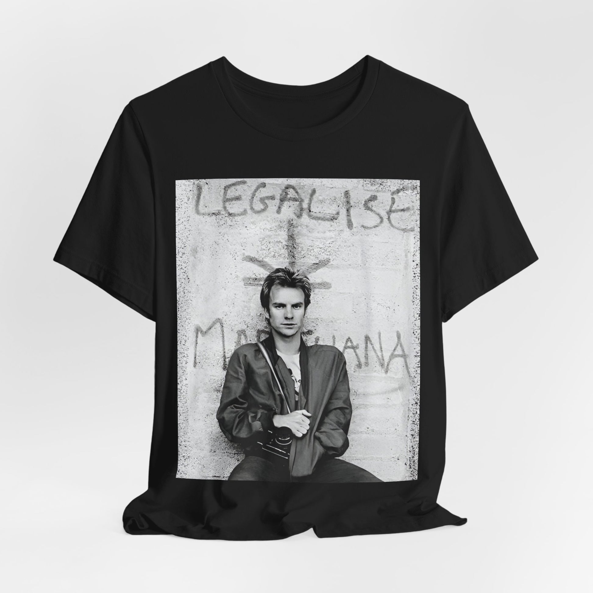 A black graphic t-shirt featuring a graphic of The Police with reggae-influenced pop elements.
