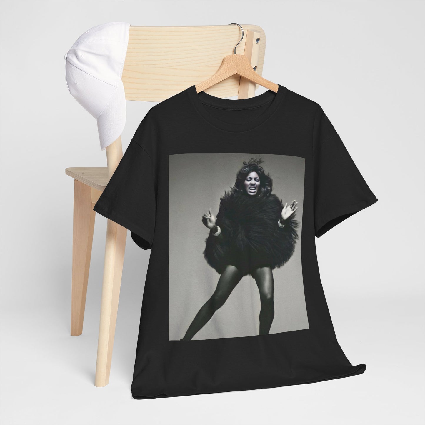 A black graphic t-shirt featuring a black and white portrait photo of Tina Turner.