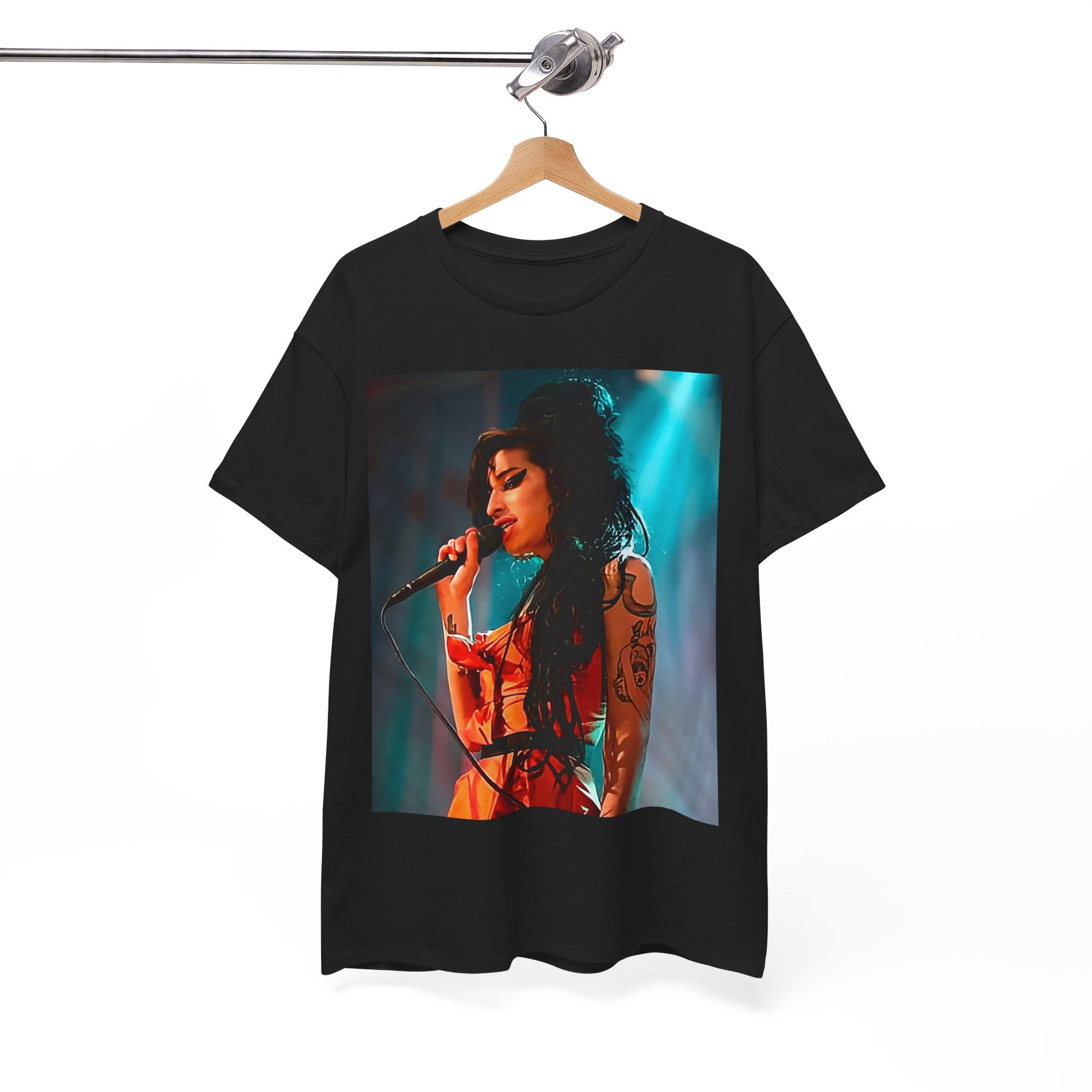 A black graphic t-shirt featuring a photo of Amy Winehouse performing live on stage in 2007, with her signature beehive and expressive singing.