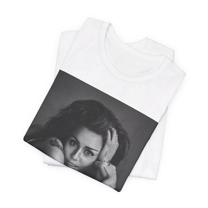 A black graphic t-shirt featuring a black and white portrait graphic of Miley Cyrus.