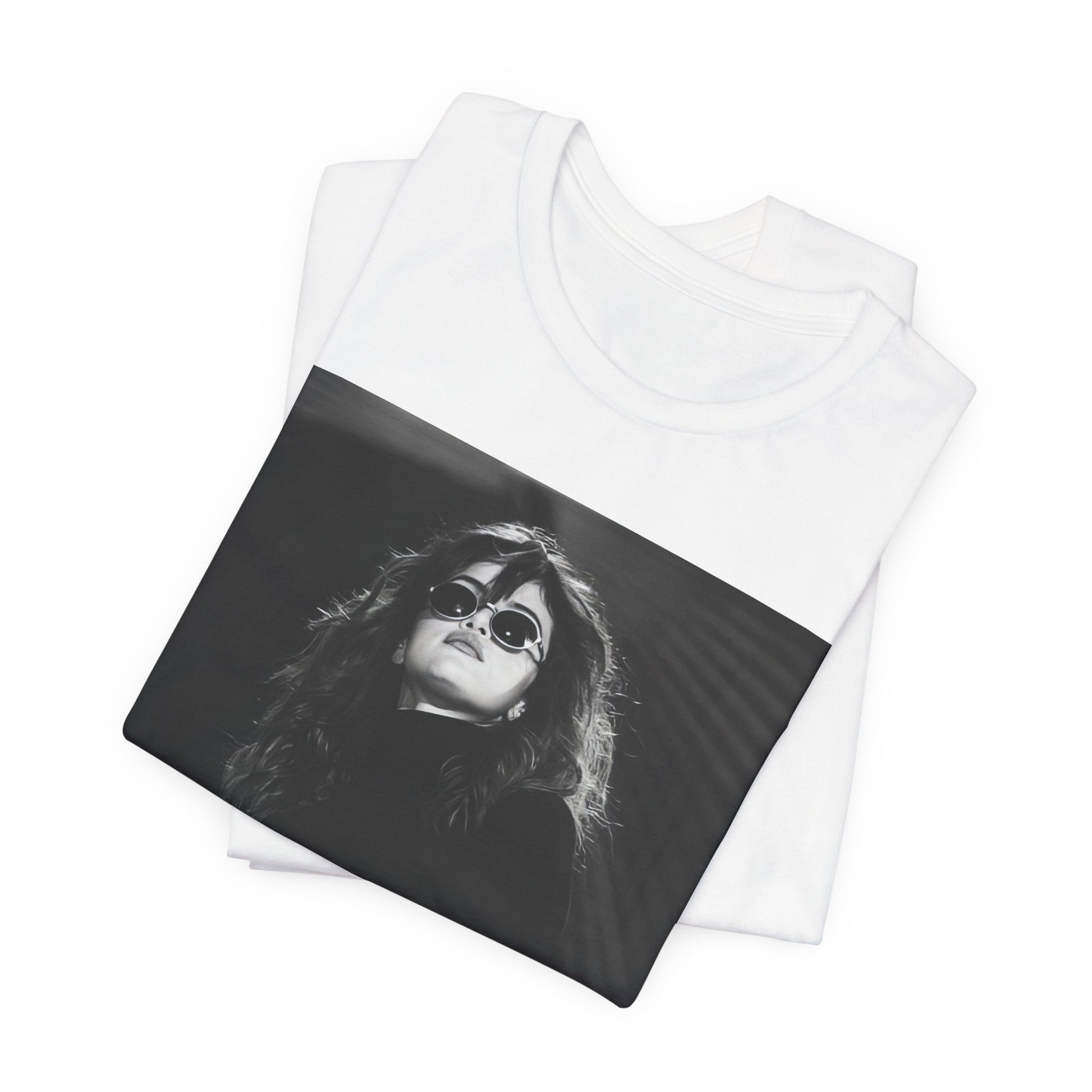 A black graphic t-shirt featuring a black and white, monochrome graphic or photo of Selena Gomez.