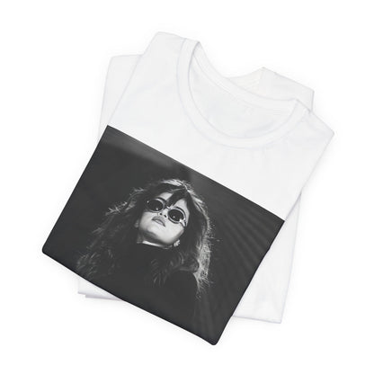 A black graphic t-shirt featuring a black and white, monochrome graphic or photo of Selena Gomez.