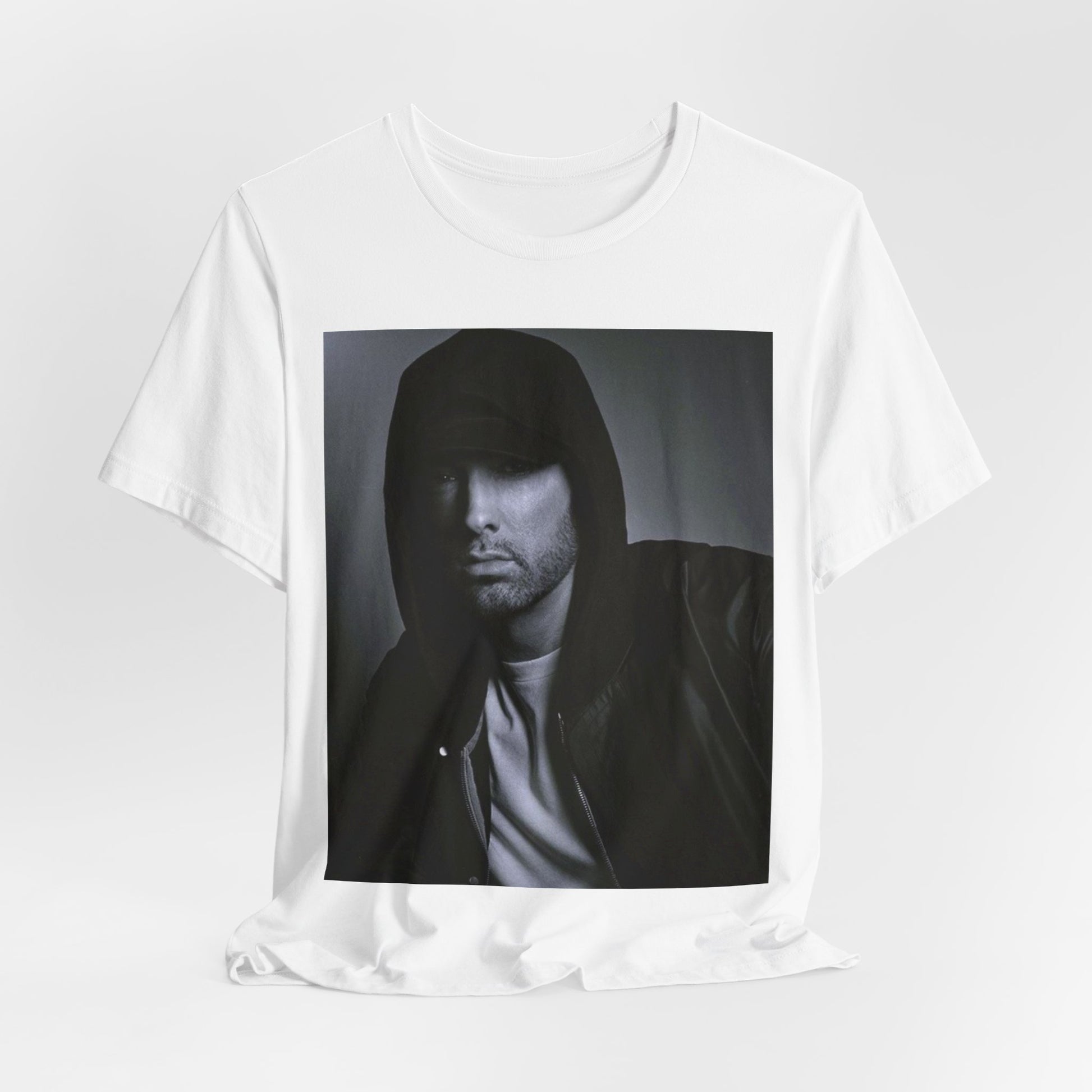 A black graphic t-shirt featuring a black and white, monochrome graphic or photo of Eminem.