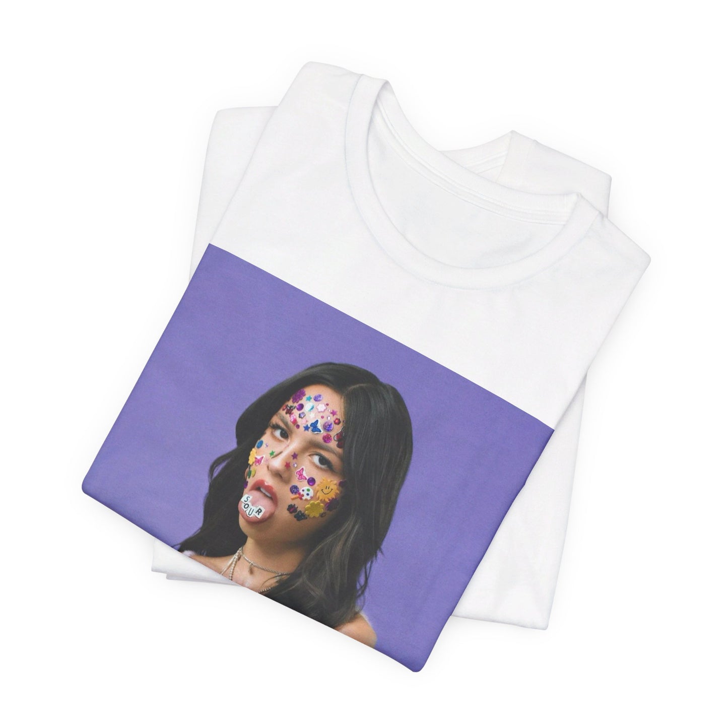 A black graphic t-shirt featuring a bold graphic of Olivia Rodrigo as a pop superstar.